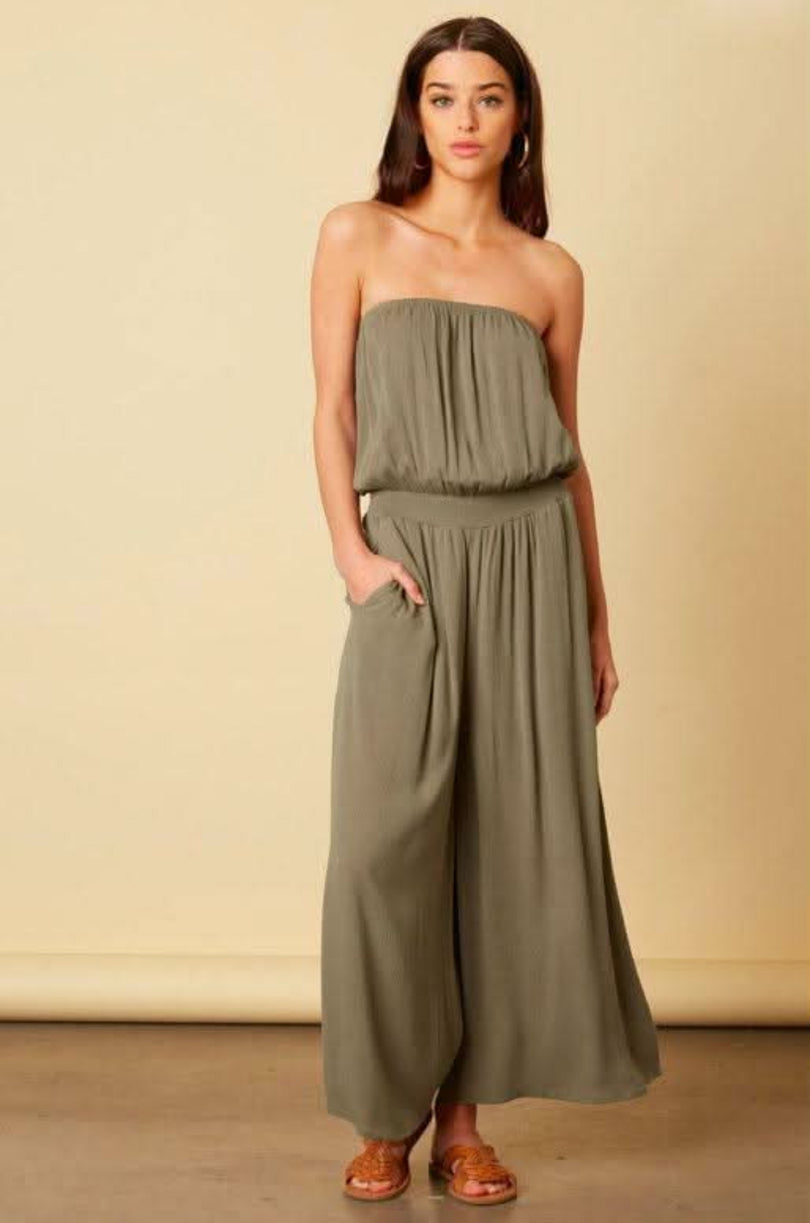 Olive strapless wide leg jumpsuit front view with smocked waist and flowy fit