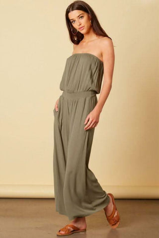 Full length olive strapless jumpsuit with flowy wide leg silhouette