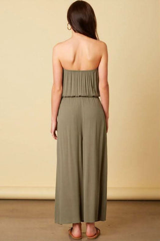 Back view of olive strapless wide leg jumpsuit with elastic waist