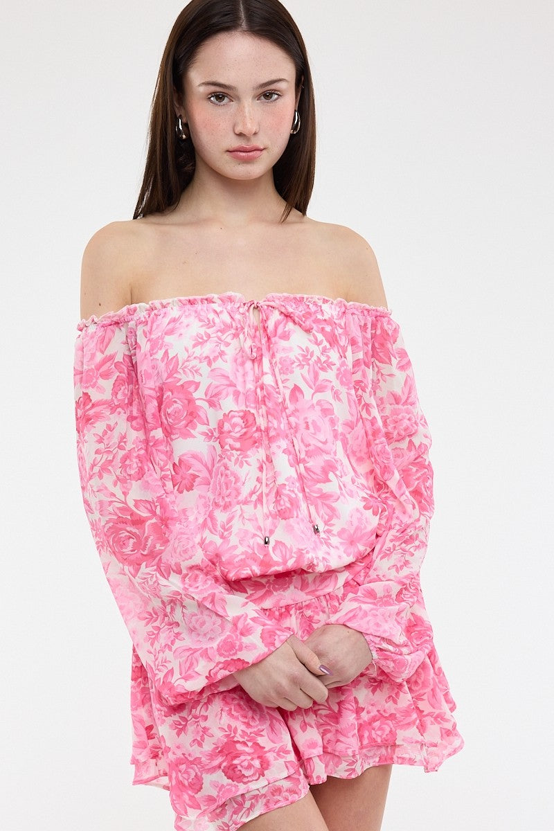 Front view of the pink floral chiffon skort dress with a tie-front neckline