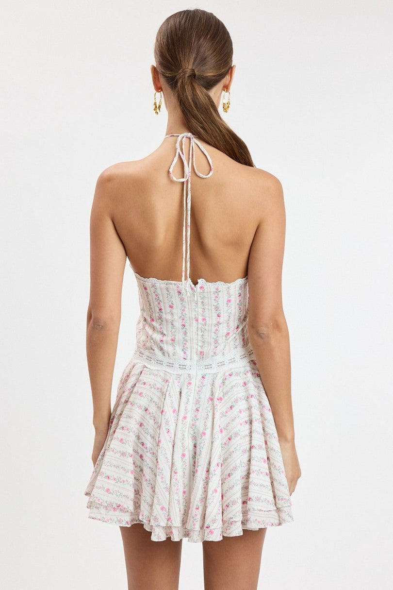 Back view of the pink floral halter dress showing the open back and hidden zipper closure