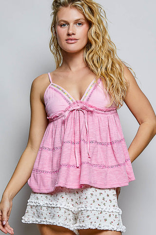 Full front view of the Kai Pink Babydoll Top showing the flowy silhouette and floral trim