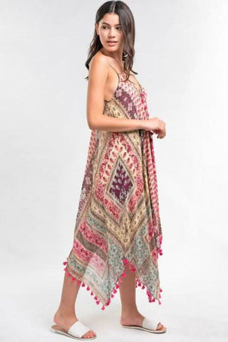 pink paisley print maxi dress with flowy silhouette and scarf hem side view