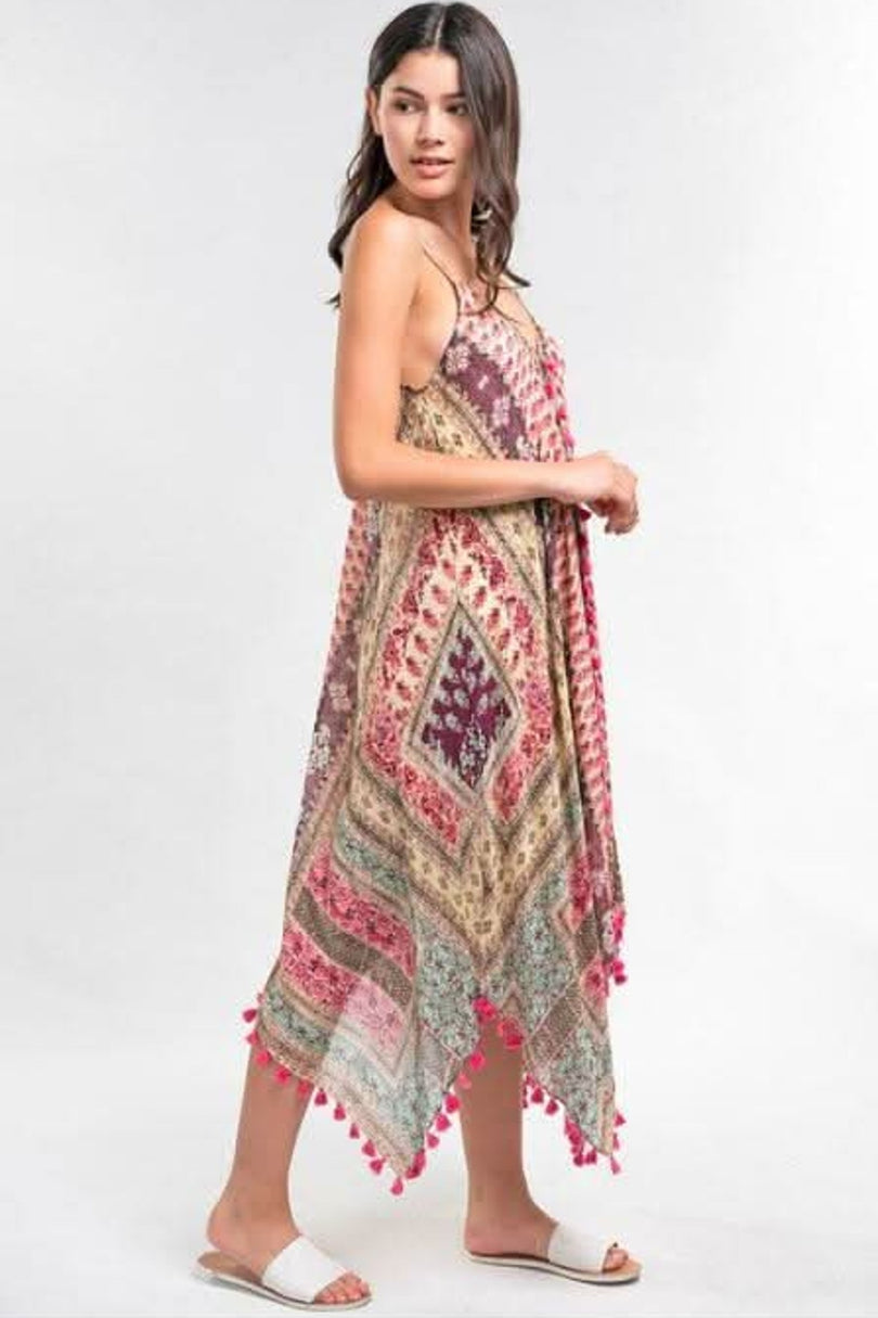 pink paisley print maxi dress with flowy silhouette and scarf hem side view