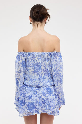 Back view of the Pixie long sleeve romper dress showing the elasticized off-the-shoulder fit