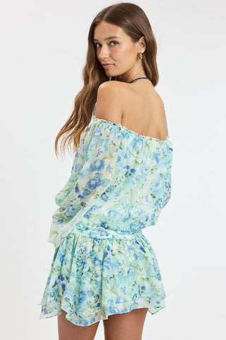 Back view of the Pixie Blue Watercolor Floral Romper Dress
