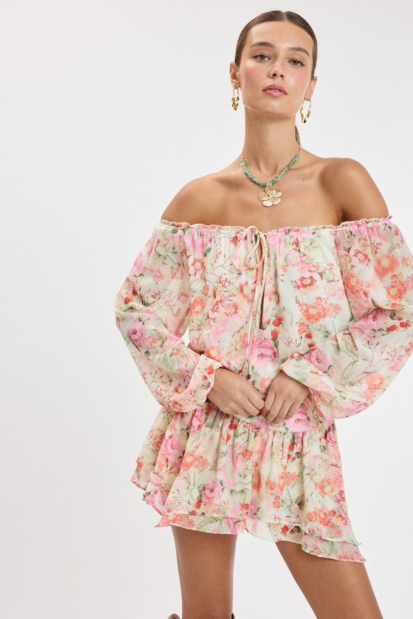 Front view of the Pixie Pink Watercolor Floral Off-the-Shoulder Romper Dress showing the flared skirt and fit