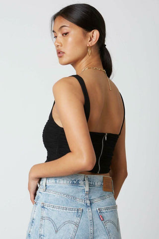 black cropped tank top with mesh overlay and angled hem - back view