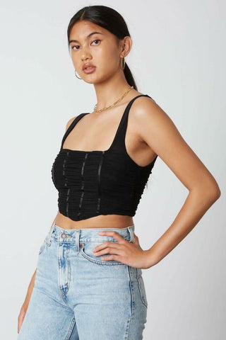 black cropped tank top with mesh overlay and angled hem - side angle view
