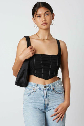 black cropped tank top with mesh overlay and angled hem - front view