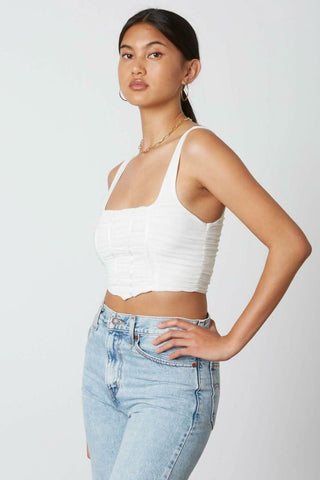 white cropped tank top with mesh overlay and angled hem - side angle view