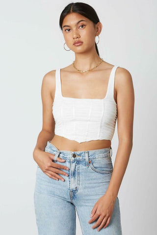 white cropped tank top with mesh overlay and angled hem - front view