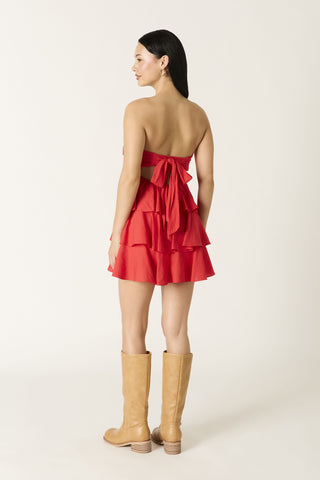 Detailed view of the secure elastic back and flowing tie on the Charlotte red dress