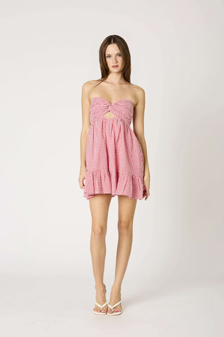 Red and white gingham fabric on a strapless summer babydoll romper 