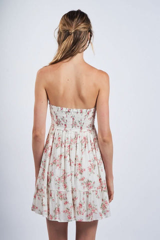 Back view vintage rose print babydoll mini dress with an empire waist and tie front