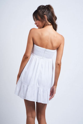 Model wearing white strapless graduation dress