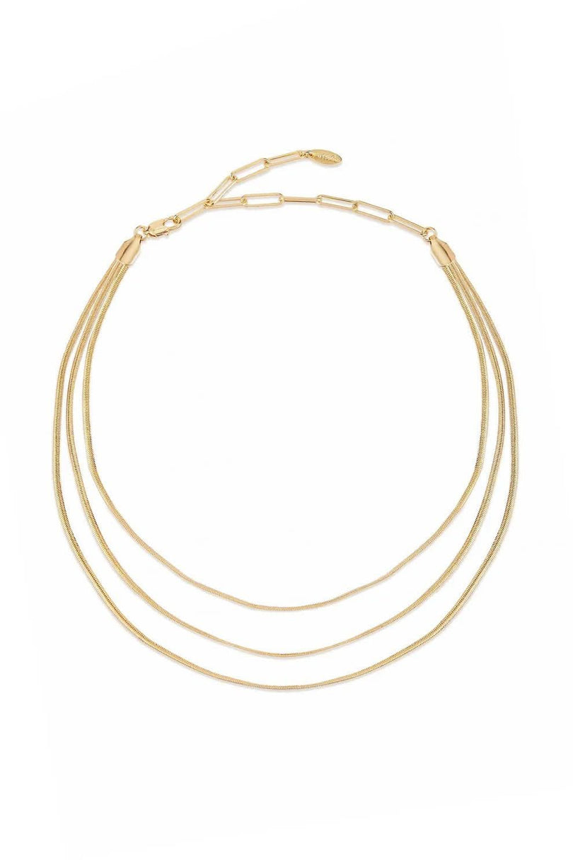 Gold layered chain necklace on white background