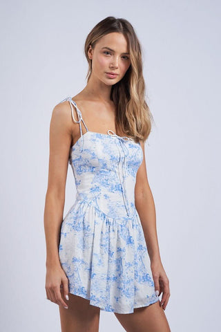 Side view of the tie-strap flower mini dress showing the fitted bodice and flared skirt.