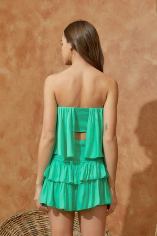 Aqua green strapless romper back view with tiered ruffle skirt