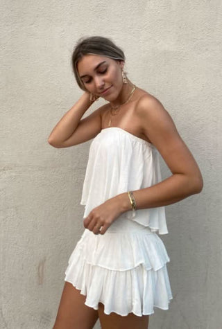 Monaco White Strapless Romper styled with gold jewelry