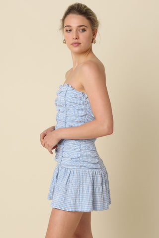Side view of Taryn Blue Gingham Strapless Mini Dress showing the drop-waist silhouette