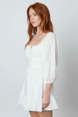 White 3/4 sleeve mini dress side view