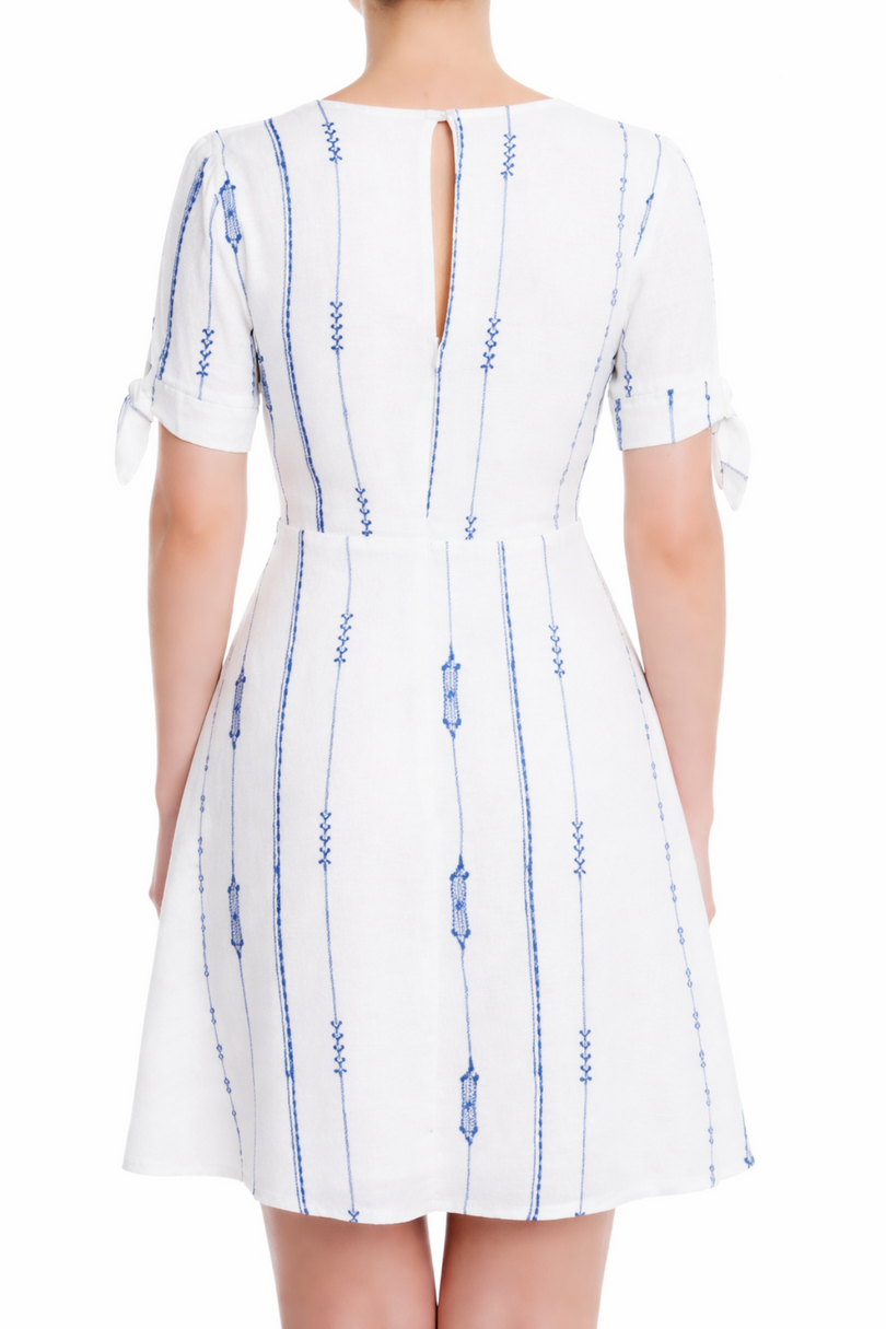 Back view of White and Blue Embroidered A-Line Mini Dress showing the hidden back zipper and tie sleeve details