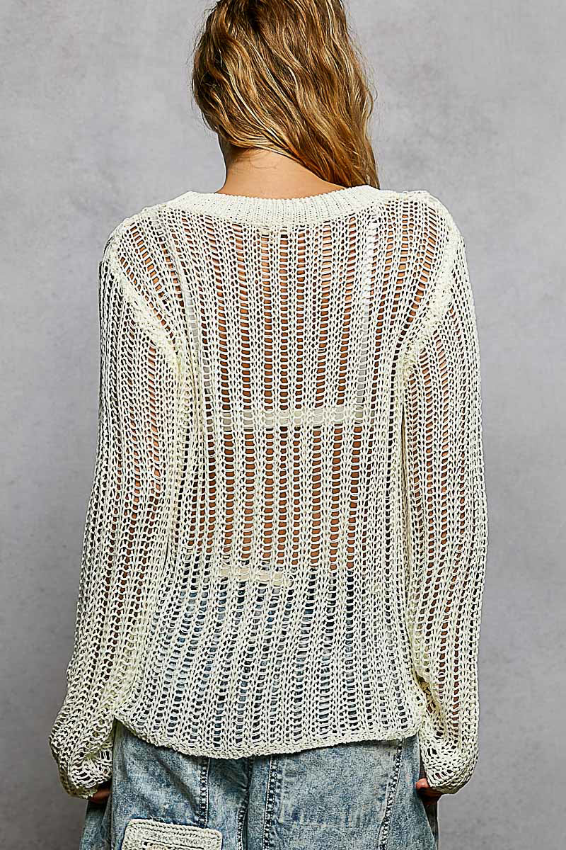 Back view of the Sola white sheer sweater showing the drop shoulder detail