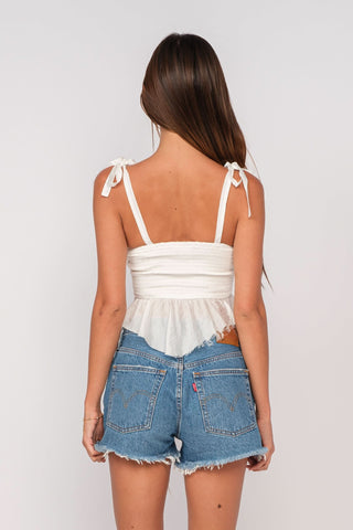 Elyse White Peplum Top back view showing ruffle hem snd tie straps
