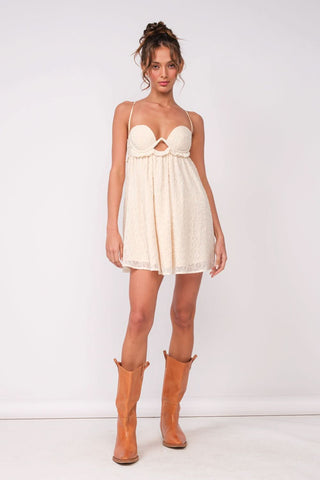 White eyelet babydoll mini dress with cami straps and cowboy boots