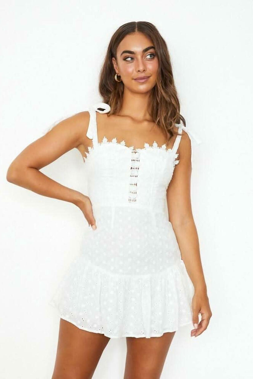 white eyelet mini dress front view crochet lace trim self tie straps