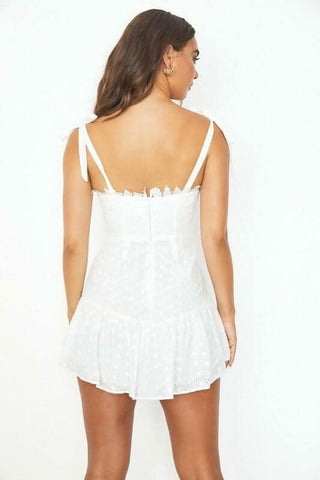 white lace mini dress back view showing zipper closure