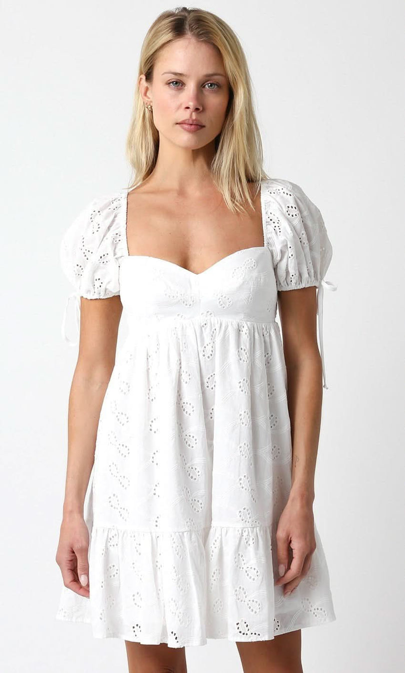 Jessie White Eyelet Babydoll Mini Dress styled as a white grad dress