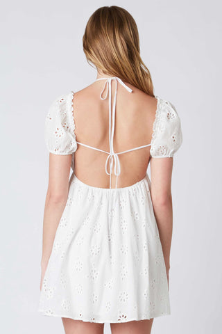 Feminine white mini dress with open tie back