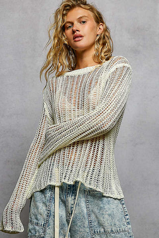Front view of the white open-knit crochet top with wide, long sleeves