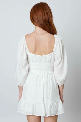 White puff sleeve mini dress back view
