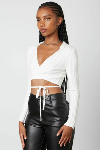 White wrap front knit top side view