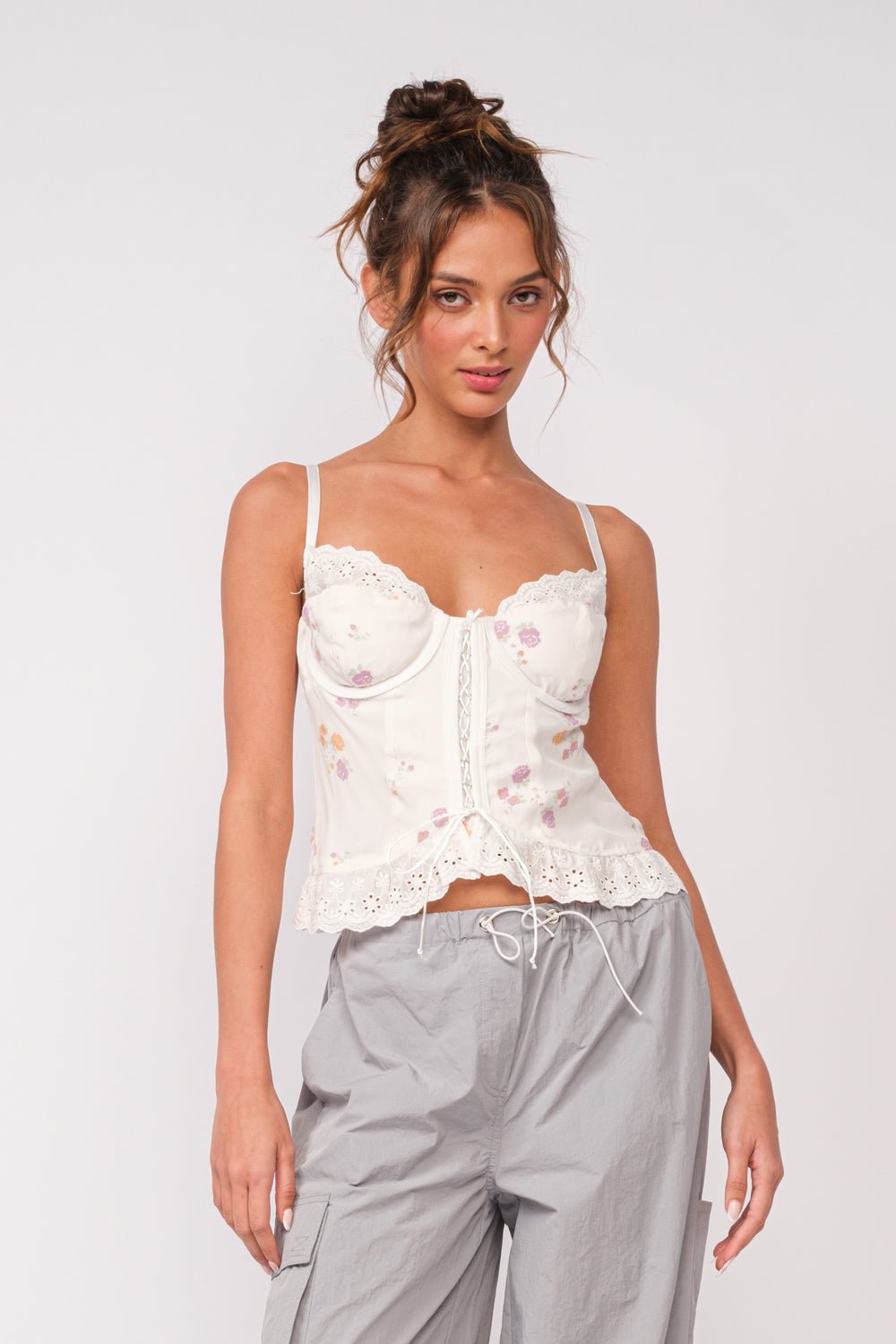 white floral corset top with jeans