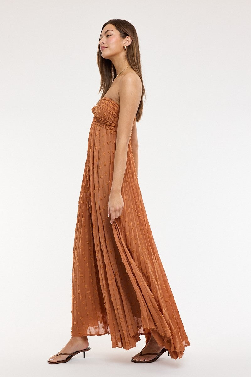 Brown strapless maxi dress with ruched bust and flowy skirt