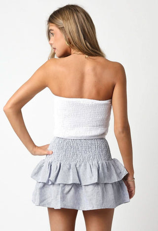 Back view of the Willow Blue Striped Linen Ruffle Mini Skirt