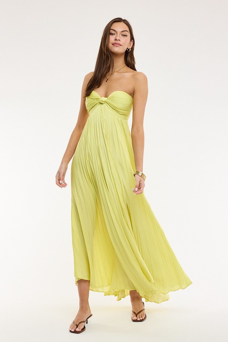 Full length view of the Willow lime yellow maxi dress highlighting the flowy pleated babydoll silhouette