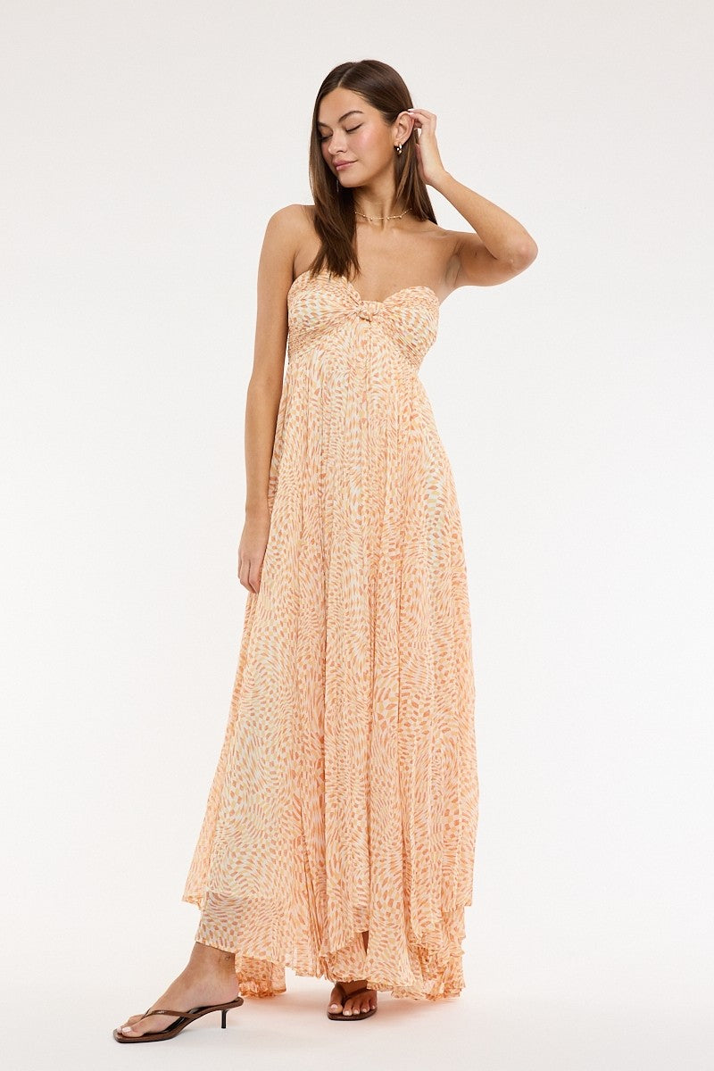 Model wearing willow orange maxi dress styled for summer