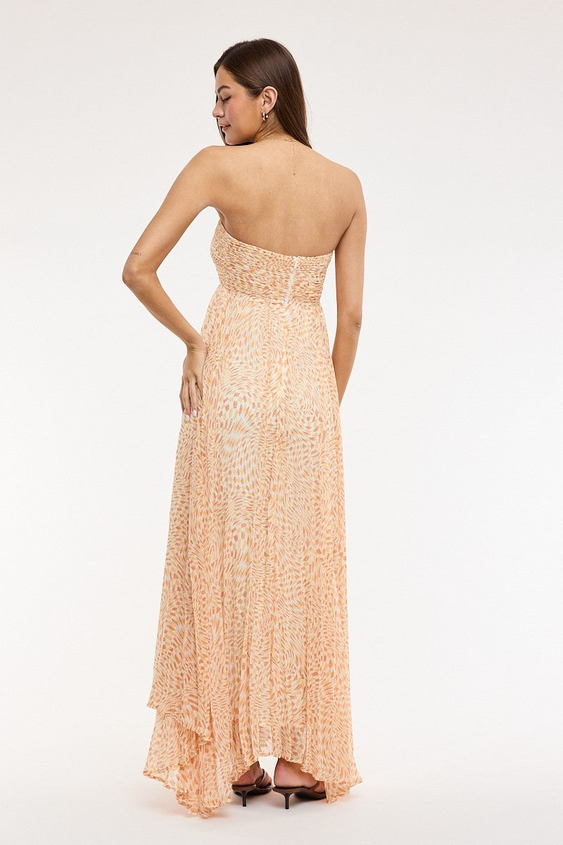 Model wearing willow orange maxi dress styled for summer