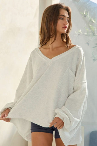 Close-up of grey terry fabric oversized sweatshirt