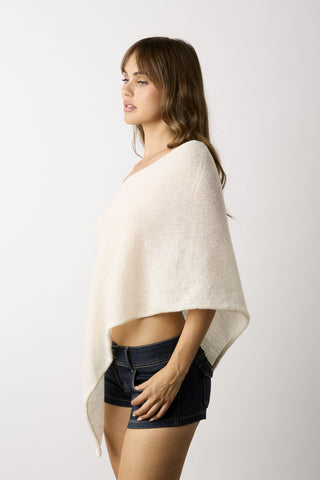 Zoya cream slouchy off-shoulder knit poncho top side view