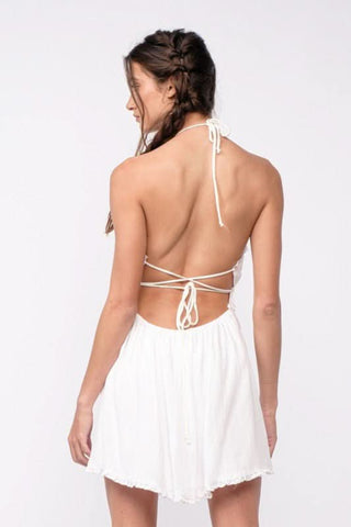 Backless white halter mini dress with plunging neckline
