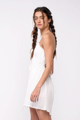 Lightweight white mini dress with deep V-neck and ruffle accents