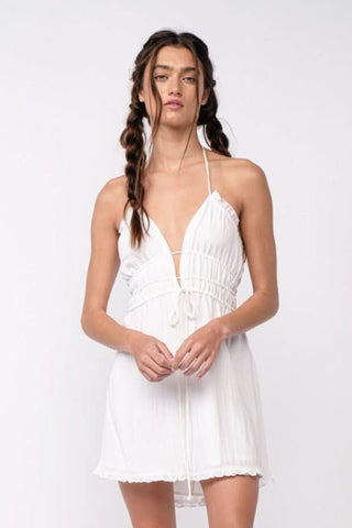 White open back halter mini dress with ruffle trim and smocked waist