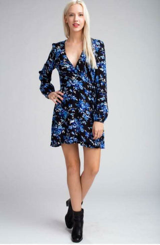 Model wearing the Middleton Black and Blue Floral Long Sleeve  Wrap Dress with black boots