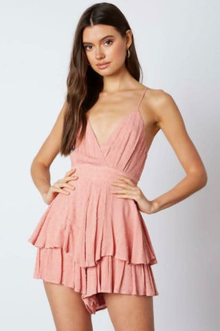 Blush pink surplice ruffle romper front view